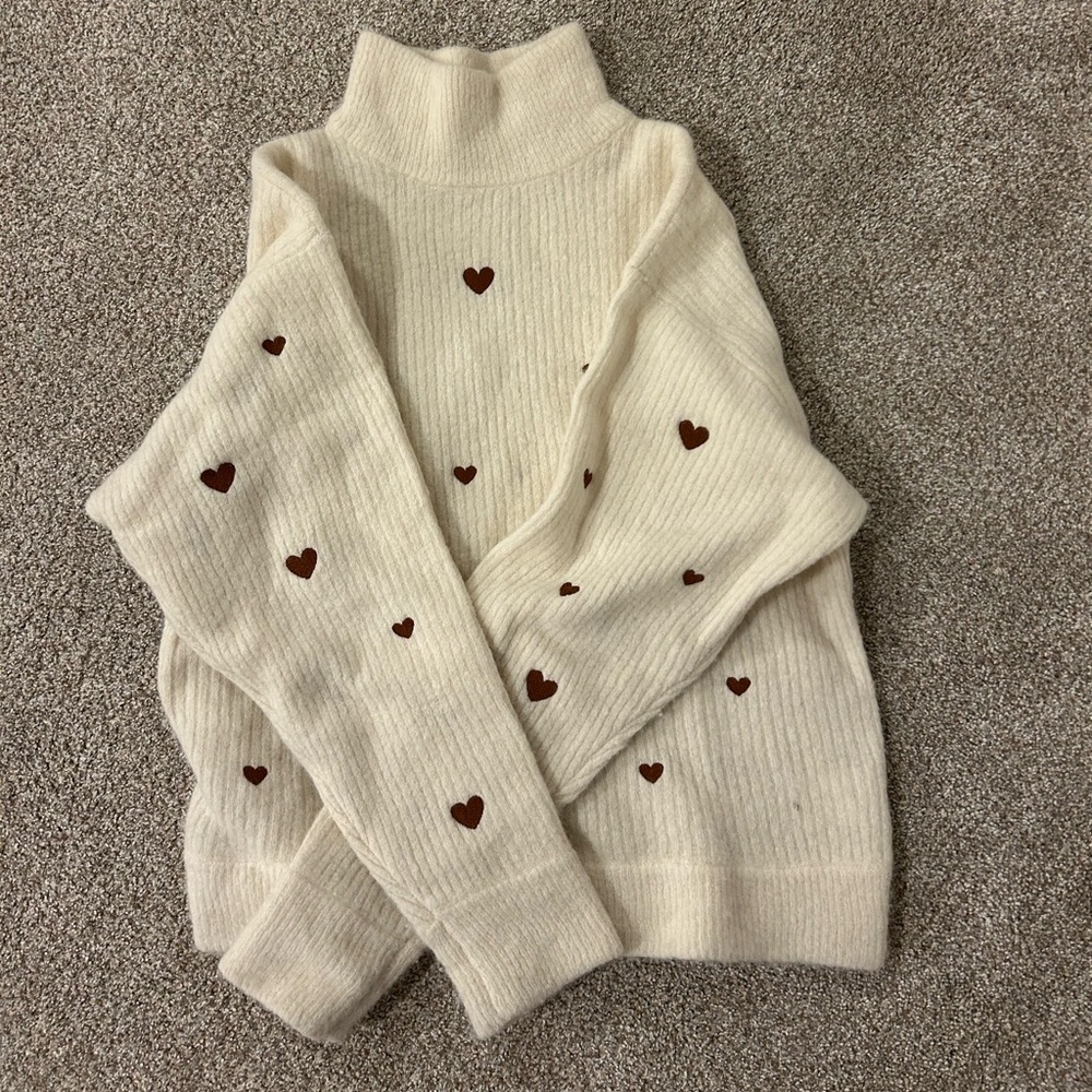 Elegant Cream Turtleneck Sweater with Heart Accents